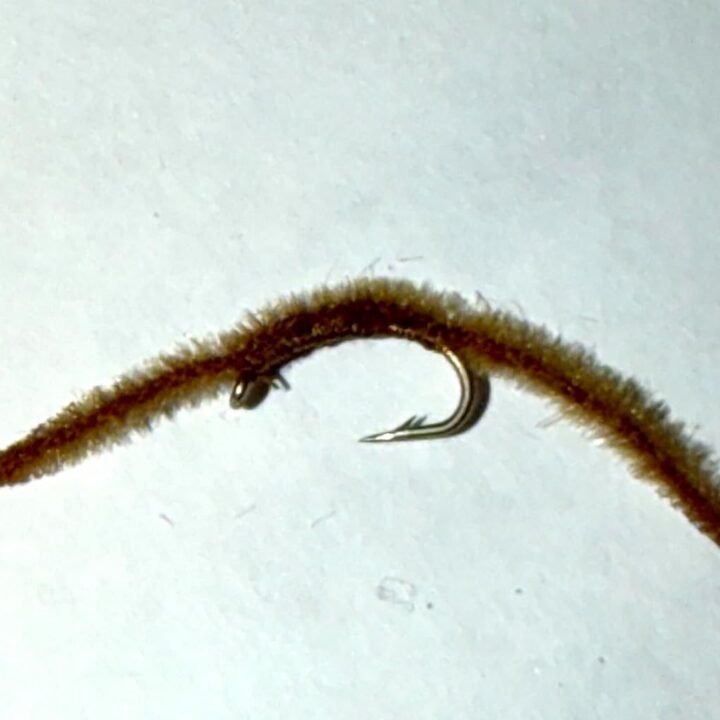 Brown San Juan Worm trout fly, size 16
